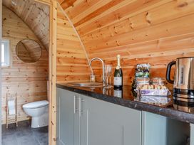 A bathroom with a sink and toilet at Peaceful pod with bay views, walk to 3 beaches in St Ives