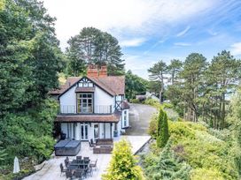 A house with a garden and patio area at tbc