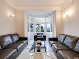 A living room with sofas and a coffee table at tbc