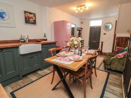 A kitchen with a dining table and chairs at Hillsover Saltburn-by-the-Sea