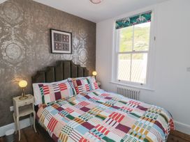 A bedroom with a bed and bedside table at Hillsover Saltburn-by-the-Sea