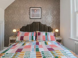 A bedroom with a bed and bedside tables at Hillsover in Saltburn-by-the-Sea