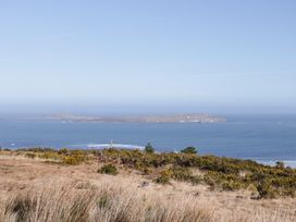 A coastal view with an island and sea at Cabin 4 Doire Chonair in Gortahawk