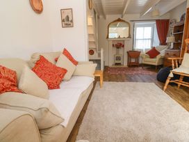 A living room with a sofa and chairs at St. Dominic Cottage St. Ives