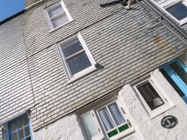 A building facade with windows and a door at St. Dominic Cottage in St. Ives