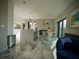 A kitchen with a table and chairs at Midways in Bowness-On-Windermere