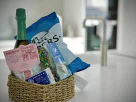 A basket containing snacks and sweets at Midways in Bowness-On-Windermere