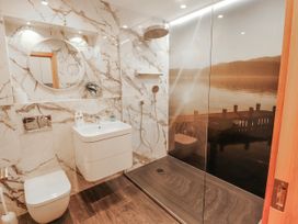 A bathroom with a shower and sink at Midways in Bowness-On-Windermere