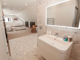 A bathroom featuring a sink and mirror at Midways Bowness-On-Windermere