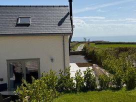 A house with a road and garden in view at Barley Cottage in Oxwich
