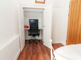 A home office with a desk and computer at Turraheen in Cashel