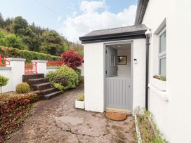 An entrance area with steps leading to a door at Artist’s Cottage in Cashel, County Tipperary