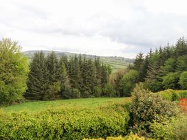 A view of trees and hills from a property at Artist’s Cottage in Cashel, County Tipperary