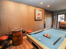 A game room with a pool table and decorative art at Bounty Boutique on the Lakes Bowness-On-Windermere