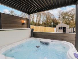 A hot tub in an outdoor area at Bounty Boutique on the Lakes Bowness-On-Windermere