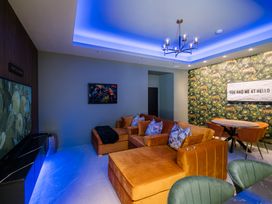 A living room with a sofa and a table at Bounty Boutique on the Lakes Bowness-On-Windermere