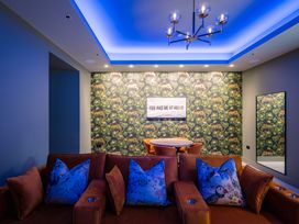 A living room with a couch and table at Bounty Boutique on the Lakes, Bowness-On-Windermere