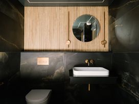 A bathroom with a sink and toilet at Bounty Boutique on the Lakes in Bowness-On-Windermere