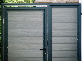 A double gate with a lock at Bounty Boutique on the Lakes in Bowness-On-Windermere