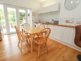 A kitchen with a table and chairs at Millmead House Portesham