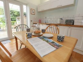 A kitchen with a table and chairs at Millmead House in Portesham