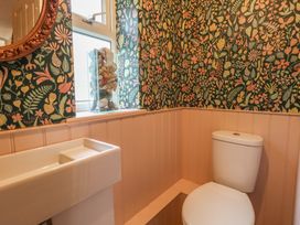 A bathroom with a toilet and sink at Millmead House in Portesham