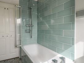 A bathroom with a bathtub and shower at Millmead House in Portesham