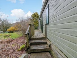 An outdoor area with steps leading to a house at L21 Coastal Kippford in Kippford near Sandyhills