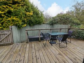 A deck area with a table and chairs at L21 Coastal Kippford Kippford near Sandyhills