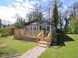 A cabin with decking and steps at 3 Faraway Fields in Dobwalls