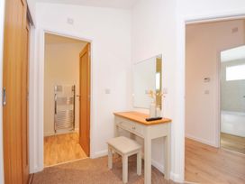 A hallway with a dressing table and mirror at 3 Faraway Fields in Dobwalls