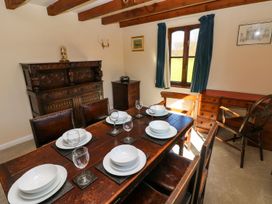 A dining room with a table set for dinner at Park Hall Cottage in Solva