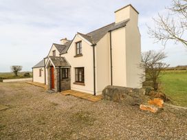 A house with a pathway and gravel at Maerdy Lodge
