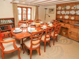 A dining room with a table set for meals at Maerdy Lodge