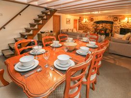 A dining room with a table set for meals at Maerdy Lodge 