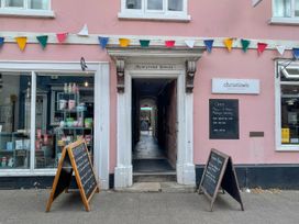 An entrance to Beresford House with a menu board at Kristine's in Woodbridge