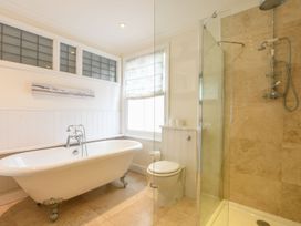 A bathroom with a bathtub and a shower at Beresford House in Woodbridge