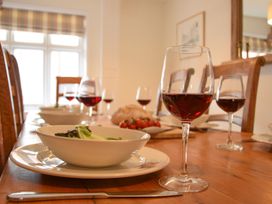 A dining room with a table set for a meal at Beresford House in Woodbridge