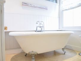 A bathroom with a bathtub and faucet at Beresford House in Woodbridge