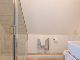 A bathroom with a shower a toilet and a towel rack at Beresford House in Woodbridge