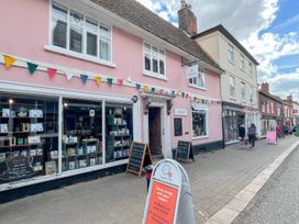 A storefront with bunting and window displays at Beresford House in Woodbridge