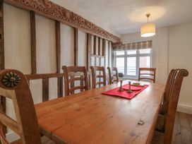 A dining room with a wooden table and chairs at Beresford House in Woodbridge