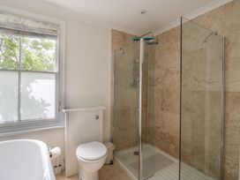 A bathroom with a shower and bathtub at Beresford House in Woodbridge