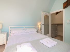 A bedroom with a bed and a nightstand at Beresford House Woodbridge