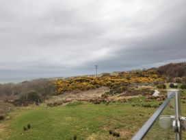 View of bushes and sea under cloudy sky at 2 Ard an Chuain Dunfanaghy