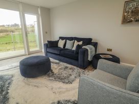 A living room with a sofa and armchair at 2 Ard an Chuain Dunfanaghy