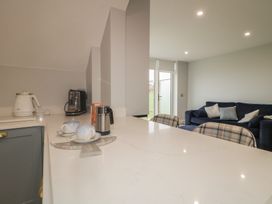 A kitchen with a kettle and coffee maker at 2 Ard an Chuain Dunfanaghy