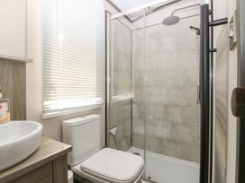 A bathroom with sink, toilet, and shower at Plot 243 - Coldingham Bay Leisure Park, Eyemouth