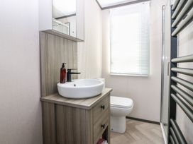 A bathroom with sink, toilet, and shower at Plot 243 - Coldingham Bay Leisure Park Eyemouth