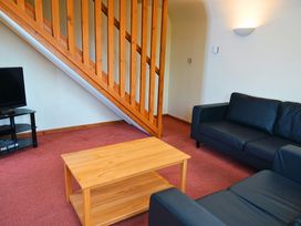 A living room with a sofa and coffee table at Bracken Lodge Finlakes Holiday Park near Chudleigh